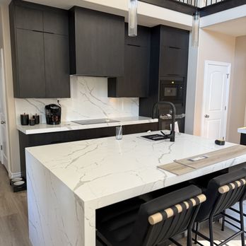 Surge Construction Services - Luxury kitchen remodel with custom cabinets, paneled appliances, and waterfall quartz countertops. - Handyman Near Me - Lehi, Utah Surge Construction Services - Luxury kitchen remodel with custom cabinets, paneled appliances, and waterfall quartz countertops. - Handyman Near Me - Lehi, Utah