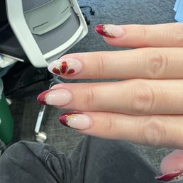 Red french tip nails with flower & chrome
