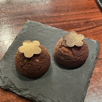 L'Atelier de Joel Robuchon - Complimentary chocolate covered whipped caramel to represent the 2 Michelin stars - French Near Me - Miami, Florida L'Atelier de Joel Robuchon - Complimentary chocolate covered whipped caramel to represent the 2 Michelin stars - French Near Me - Miami, Florida