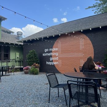 Local Habit - a woman sitting at a table outside of a restaurant - Coffee & Tea Near Me - Nash, Texas Local Habit - a woman sitting at a table outside of a restaurant - Coffee & Tea Near Me - Nash, Texas