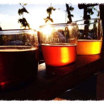 Crux Fermentation Project - Sunset and samplers. What more could you ask for? (Besides silverware) - Brewpubs Near Me - Bend, Oregon