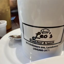 Leo’s Breakfast and Lunch - Leo's coffee mug showing logo address and phone info.