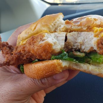 Chick-fil-A - A bite out of Original Deluxe Chicken Sandwich - Fast Food Near Me - Upland, California Chick-fil-A - A bite out of Original Deluxe Chicken Sandwich - Fast Food Near Me - Upland, California