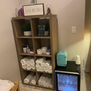VIVA Wellness - Sauna room with waters, towels, cold rags, items to refresh after the sauna - Saunas Near Me - Brookfield, Wisconsin