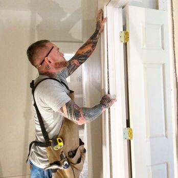 RJT Carpentry & Tile - a man working on a door - General Contractors Near Me - Boston, Massachusetts RJT Carpentry & Tile - a man working on a door - General Contractors Near Me - Boston, Massachusetts