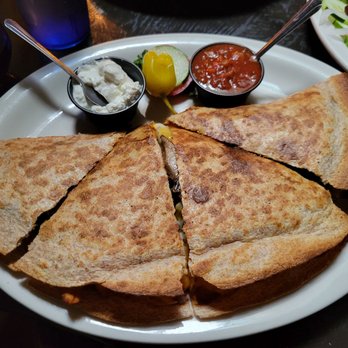 The Caves - Bacon, onion, grilled chicken quesadilla. It was so big, I only ate half. Served with salsa and sour cream. Perfectly seared pita. - Coffee & Tea Near Me - Edgewater, New Jersey The Caves - Bacon, onion, grilled chicken quesadilla. It was so big, I only ate half. Served with salsa and sour cream. Perfectly seared pita. - Coffee & Tea Near Me - Edgewater, New Jersey
