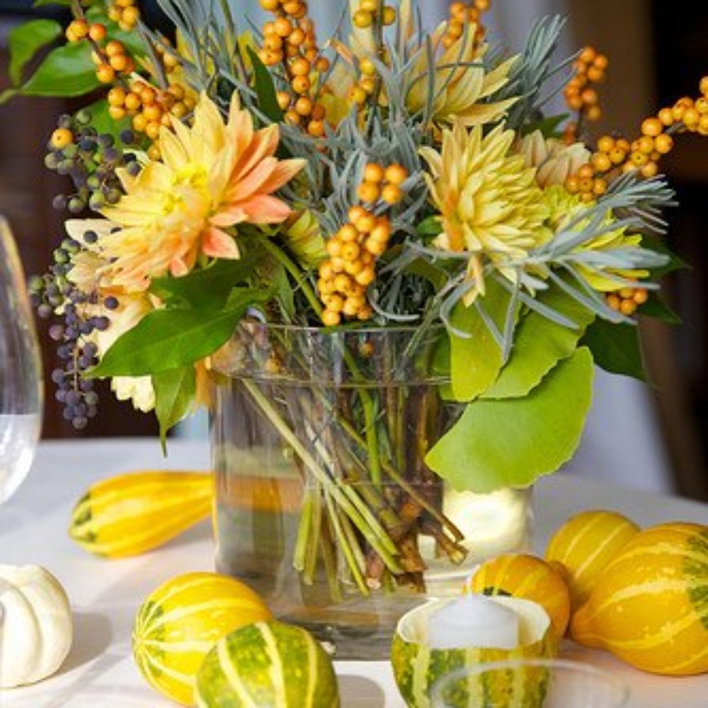Sugar Magnolias - Centerpiece with winter squash votives. - Florists Near Me