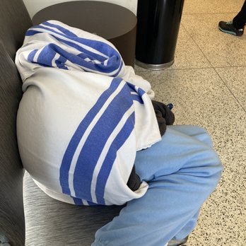 Saint Francis Hospital - Person resting in the waiting room - Hospitals Near Me - Tulsa, Oklahoma