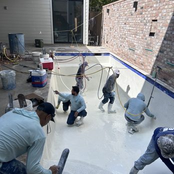 Bluebonnet Custom Pools - Bluebonnet Custom Pools and Modern Method installing Pebble Tec plaster custom Pools downtown Houston - Pool & Hot Tub Service Near Me - Katy, Texas