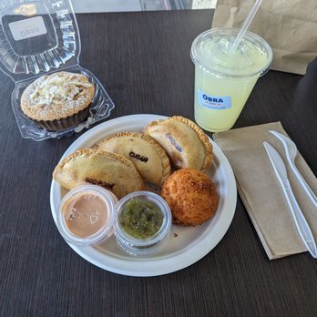 OBRA HandBakery - Coconut dulce de leche cake, BBQ pork + Cuban + chicken empanadas, potato ball, and lemonade. - Latin American Near Me - Long Beach, California OBRA HandBakery - Coconut dulce de leche cake, BBQ pork + Cuban + chicken empanadas, potato ball, and lemonade. - Latin American Near Me - Long Beach, California