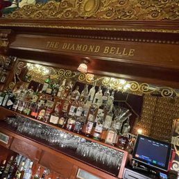 a bar with many bottles of liquor