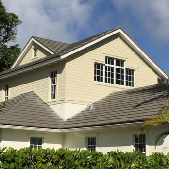 South Florida Construction Group - a white house with a brown roof - General Contractors Near Me - Pompano Beach, Florida South Florida Construction Group - a white house with a brown roof - General Contractors Near Me - Pompano Beach, Florida