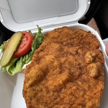 Schnitzel Works - Massive pork schnitzel. On the left is the size of the bun! - Salad Near Me - Ottawa, Ontario