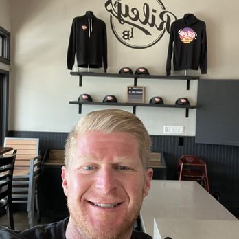 Riley’s on 2nd - Riley in front of Riley Merch - New American Near Me - Long Beach, California