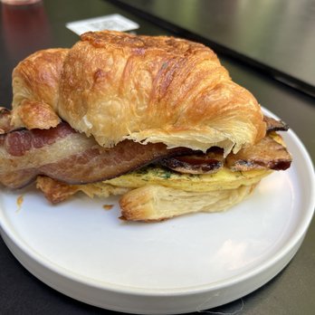 Mr West Cafe Bar Downtown - Egg and Cheese Croissant sandwich, with bacon and avocado. - Bars Near Me - Seattle, Washington Mr West Cafe Bar Downtown - Egg and Cheese Croissant sandwich, with bacon and avocado. - Bars Near Me - Seattle, Washington