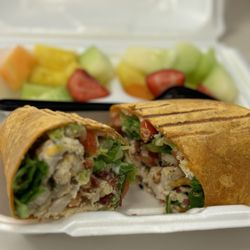 The Bridge Cafe - Best Chicken Caesar Salad Club wrap with fresh fruit