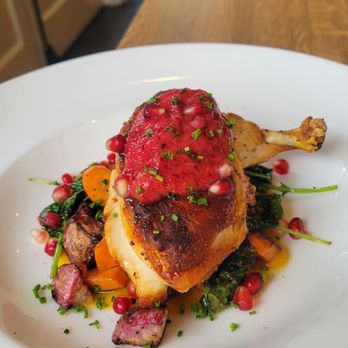 El Dorado Kitchen - Roasted chicken with a pomegranate sauce and lovely puree underneath it with the veggies and maybe potatoes. - New American Near Me - Sonoma, California