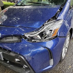 Before repairs (license plate blurred)