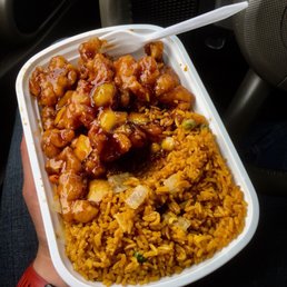 a person holding a container of food