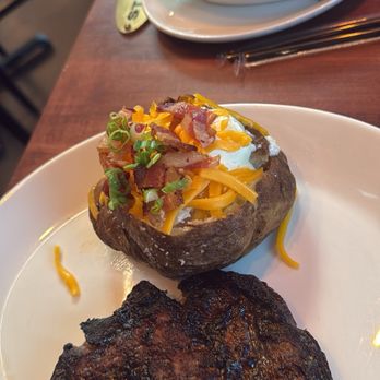 Stoney River - Ribeye, loaded potato, wild mushrooms - Steakhouses Near Me - Madison, Alabama Stoney River - Ribeye, loaded potato, wild mushrooms - Steakhouses Near Me - Madison, Alabama