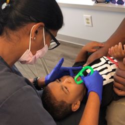 Springfield Pediatric Dentistry - Showing one of our favorite guys, and his mom, how to keep those new teeth clean at home!