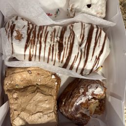 That's a frosted Cruller,  a zebra tail, a maple pillow, and what's left of a glazed pillow. These are fantastic.!