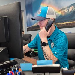 Albuquerque Auto Repair & Tire - Alec taking care of customers concerns.
