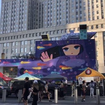 Mural Project - Cosmic Traveler mural with smorgasburg in front - Art Galleries Near Me - New York, New York