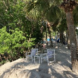Florida Houseboat Vacations - Private beach area for guests. Includes a kayak paddleboard launch, fire pit, BBQ area, unique pontoon boat swimming pool & evening lighting
