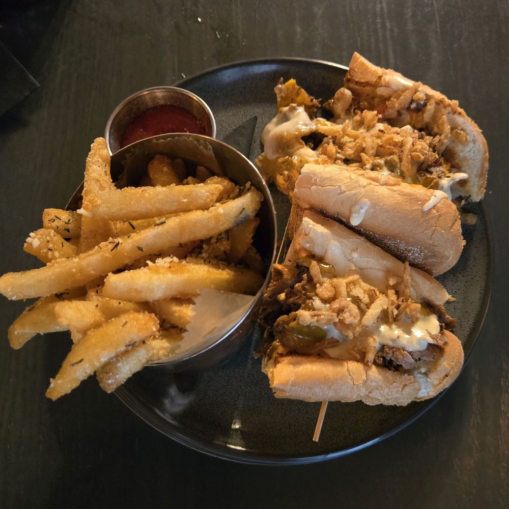 The Stubborn Mule - Chipotle cheesesteak and rosemary parm fries - New American Near Me - Orlando, Florida The Stubborn Mule - Chipotle cheesesteak and rosemary parm fries - New American Near Me - Orlando, Florida