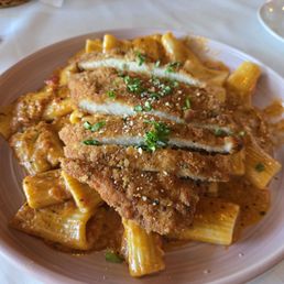 Rigatoni with a la vodka sauce and Chicken cutlets. Rigatoni with a la vodka sauce and Chicken cutlets.