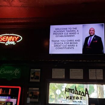 Academy Tavern - a man on a television screen - Bars Near Me - Cleveland, Ohio