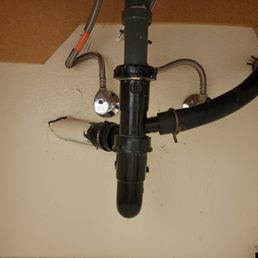 Bathroom sink drain pipe with curved condensation line on the right. Bathroom sink drain pipe with curved condensation line on the right.