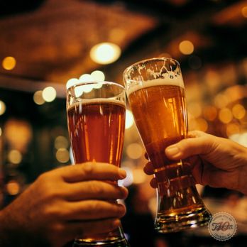 10Tavern - two people toasting with beer glasses - Burgers Near Me - Thurmont, Maryland