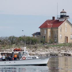 Shoreline Scenic Cruises and Charters - Pilot Island Lighthouse in Deaths Door Passage.