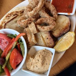 Crispy Calamari, spinach rice, potatoes, Greek Salad, Hummus Served with Warm Pita Crispy Calamari, spinach rice, potatoes, Greek Salad, Hummus Served with Warm Pita