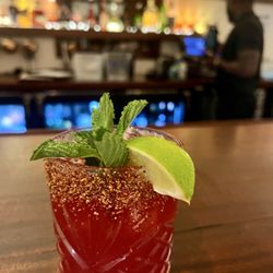 Hamilton’s - Hibiscus Margarita, featuring Don Julio Blanco tequila and finished with a lime wedge, fresh mint and a Tajin rim.