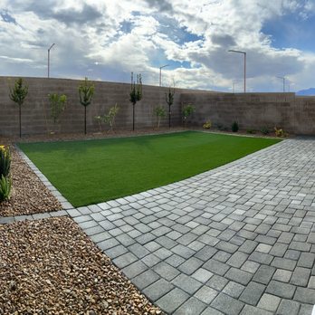 Silia Landscape Construction - a backyard with artificial grass - Masonry/Concrete Near Me Silia Landscape Construction - a backyard with artificial grass - Masonry/Concrete Near Me