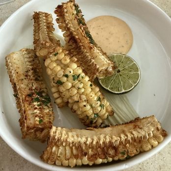 O'Kims - Corn ribs. Well seasoned. I didn't need the sauce, but my brother enjoyed it. - Korean Near Me - Honolulu, Hawaii