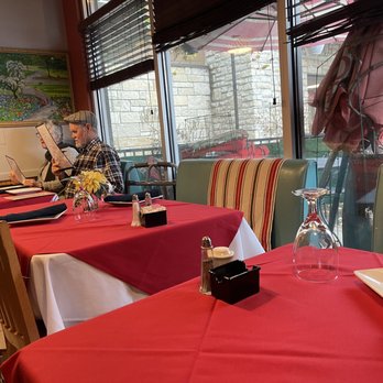 LEYLA MEDITERRANEAN - a woman sitting at a restaurant table - Mediterranean Near Me - Cincinnati, Ohio LEYLA MEDITERRANEAN - a woman sitting at a restaurant table - Mediterranean Near Me - Cincinnati, Ohio
