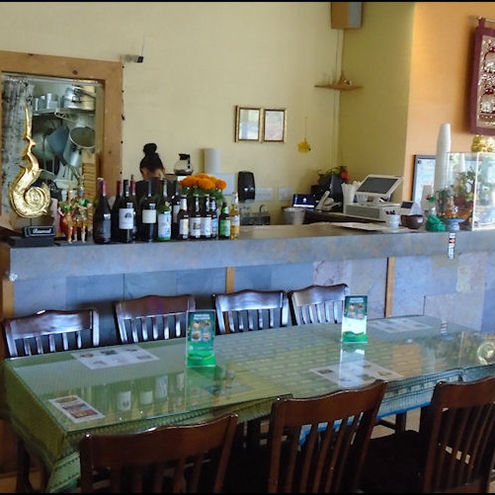 Khun Suda - The focus of the dining room is the counter, which displays the selection of beer and wine the restaurant offers. - Thai Near Me - Roseville, California