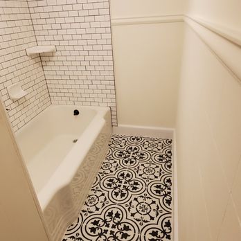 Gilley's Remodeling & Repair - a bathroom with a tiled floor - Handyman Near Me Gilley's Remodeling & Repair - a bathroom with a tiled floor - Handyman Near Me