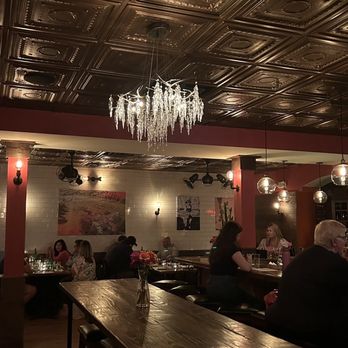 Bar Sera - people sitting at tables and a chandelier - New American Near Me - Conshohocken, Pennsylvania