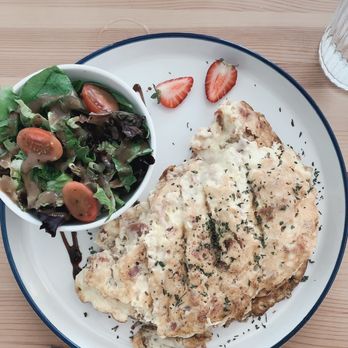 La Creperie - Bacon and Swiss omelette with a side of dressed greens - Creperies Near Me - Holmes Beach, Florida La Creperie - Bacon and Swiss omelette with a side of dressed greens - Creperies Near Me - Holmes Beach, Florida