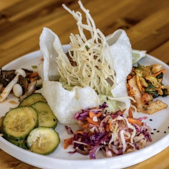 86 Forks Bar + Table - Buddha Plate. House made kimchi, Asian slaw, cucumbers, peanut sauce with rice  noodles, edamame hummus, and a mushroom salad. Delicious! - Asian Fusion Near Me - Pensacola, Florida