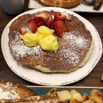 First Watch - Lemon Ricotta pancakes with Lemon Curd and fresh berries. Back plate has a Belgian Waffle, over easy eggs and pork sausage. - Breakfast & Brunch Near Me - Virginia Beach, Virginia First Watch - Lemon Ricotta pancakes with Lemon Curd and fresh berries. Back plate has a Belgian Waffle, over easy eggs and pork sausage. - Breakfast & Brunch Near Me - Virginia Beach, Virginia