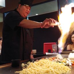 Chef Jay lighting an onion volcano