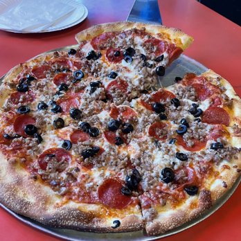 Za Pizza - a pizza with pepperoni and olives - Pizza Near Me - San Francisco, California