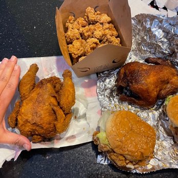 Moon Flower House - Hand next to chicken to show size - Burgers Near Me - Boston, Massachusetts Moon Flower House - Hand next to chicken to show size - Burgers Near Me - Boston, Massachusetts
