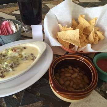 El Manantial - Complimentary chips, salsa and beans with an order of queso with beef - Mexican Near Me - Amarillo, Texas